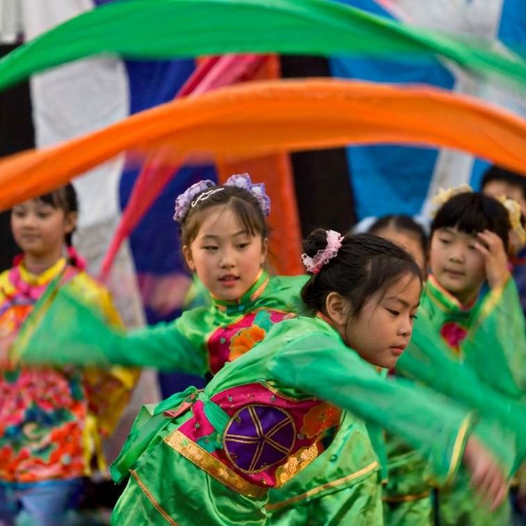 Dance group performing at a community event