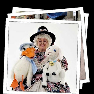 Mother Goose character with puppets
