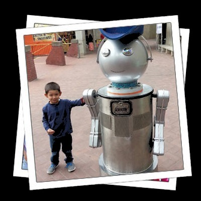 Costumed robot character greeting a child