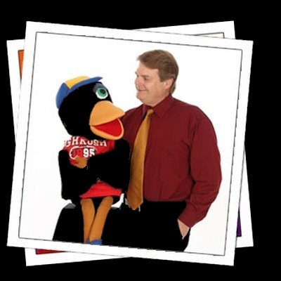 Ventriloquist with his bird puppet